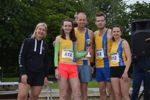 The mixed Bournemouth AC team pic up their trophy