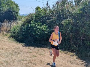 Helen Beddoe finishing the Blackmore Vale Half Marathon