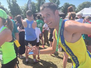Stu Nicholas doing the pose from his trophy
