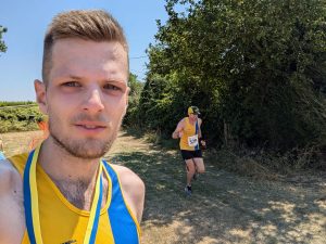 Tom Casson with Clint Taylor finishing in the background at the Blackmore Vale Half Marathon