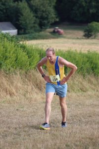 Clint Taylor with his hands on his hips in the Sunflower Stride