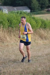 David Crowther heading through the field in the Sunflower Stride