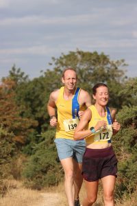 Helen Beddoe and Clint Taylor running past in the Sunflower Stride