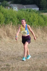 Helen Beddoe heading through the field in the Sunflower Stride