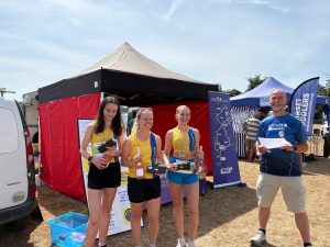 The Bournemouth AC ladies collect their prizes for winning the team competition