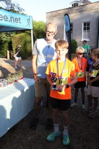 Seth Hollyman collects his trophy for finishing second in the Junior Summer Series