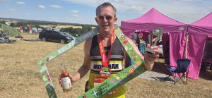 Stu Glenister with his trophy after the Apple Plod 10k.ish